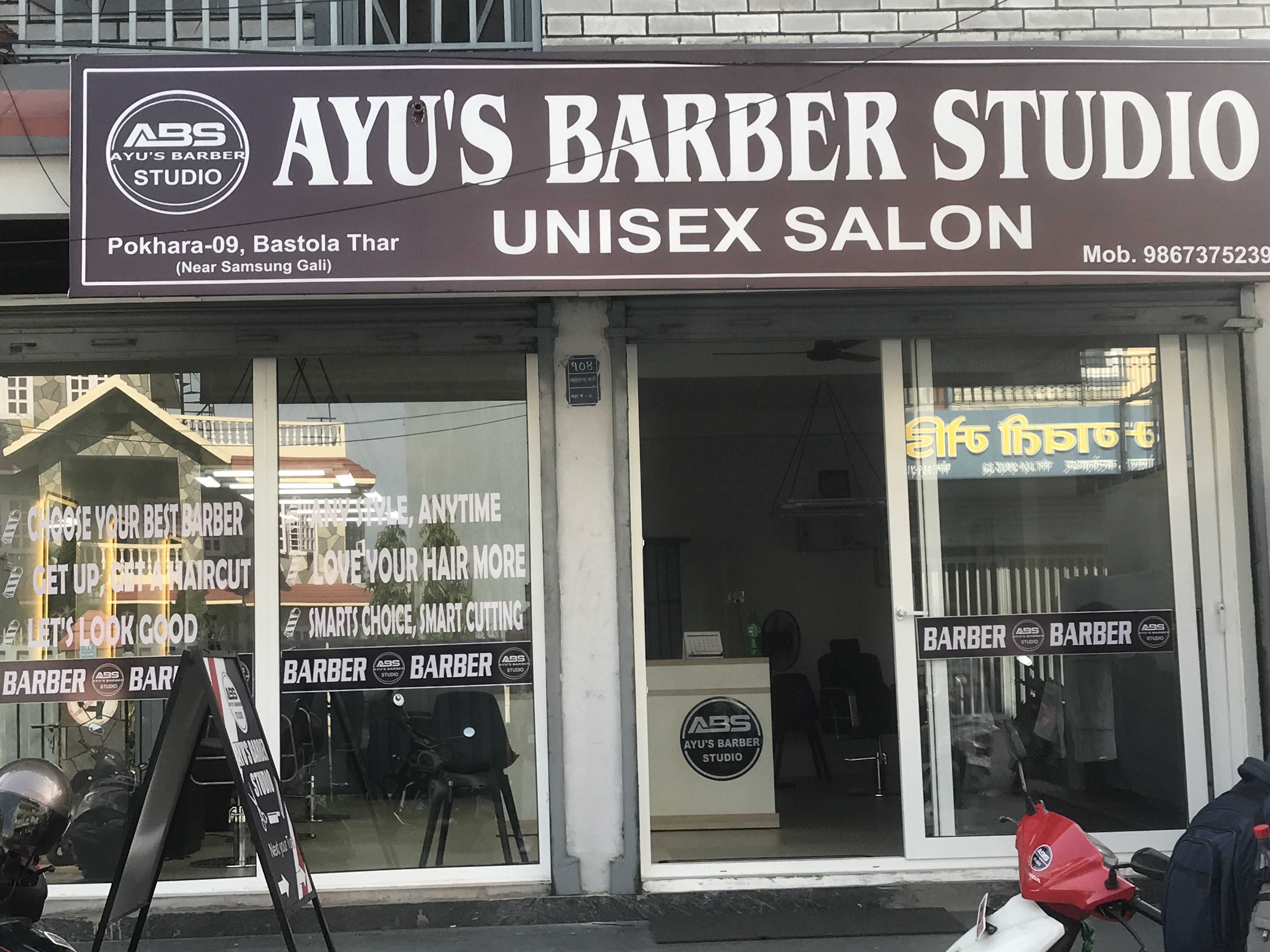 Ayu's Barber Studio exterior sign and entrance at Bastola Thar