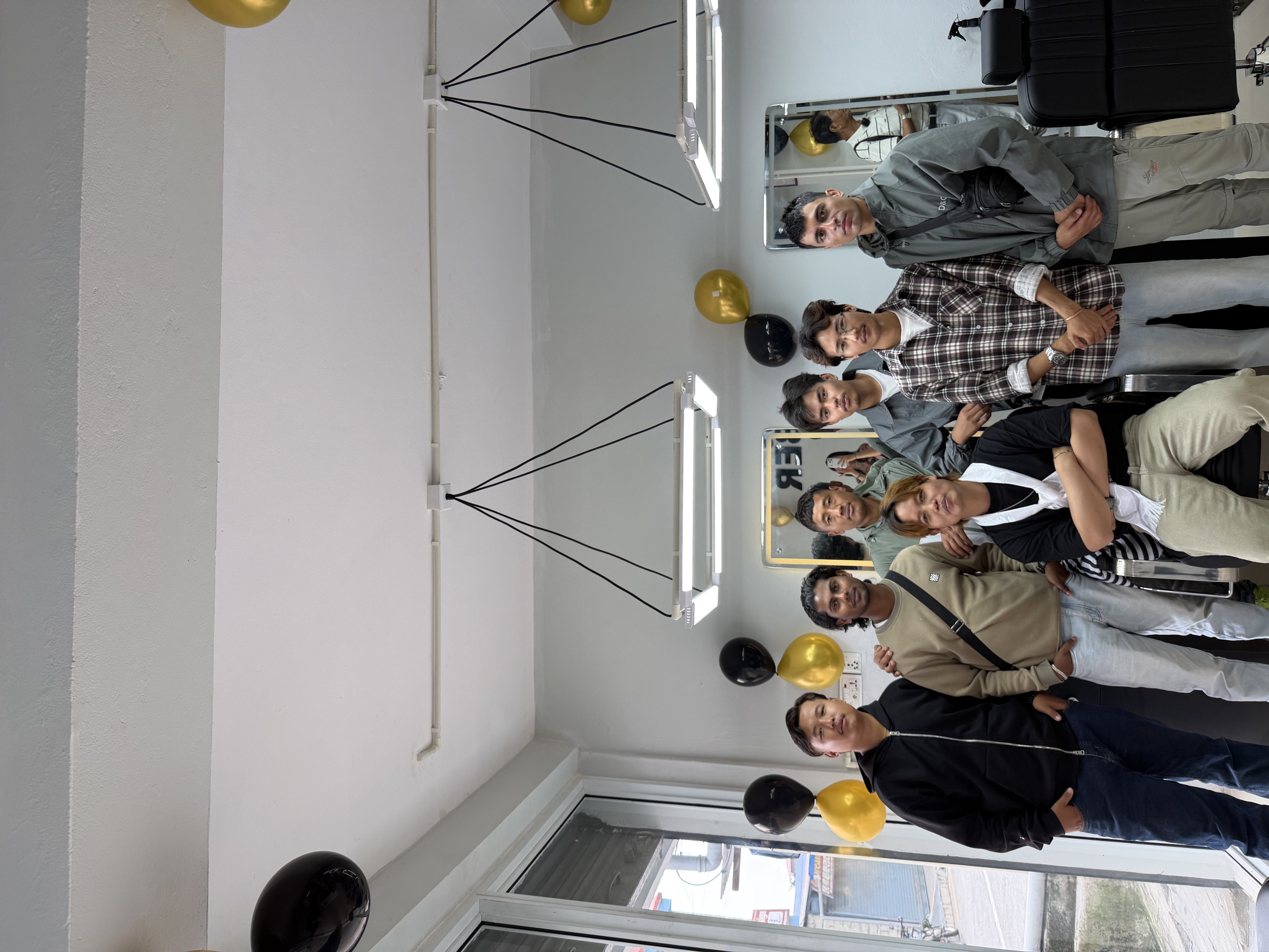 Ayu's Barber team gathered inside the shop