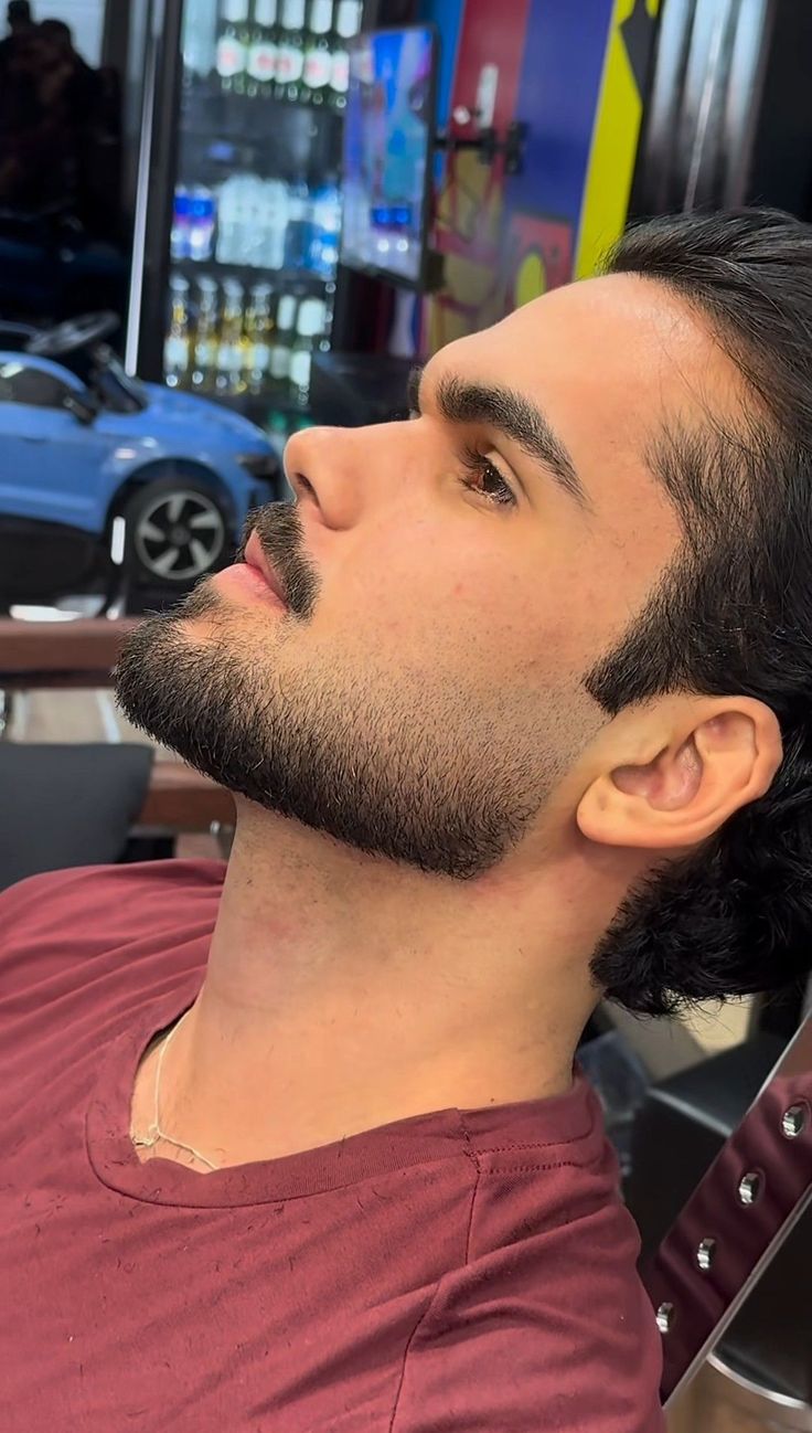 Side view of clean full beard trim with sharp edges