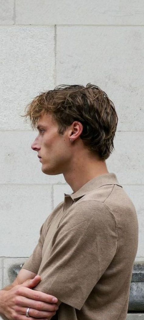 Side view of soft layered men's hairstyle